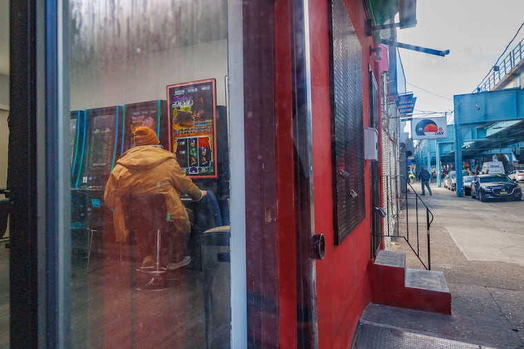 File photo of a man playing a so-called "skill game" machine at a store on Kensington Avenue on Feb. 29, 2024.