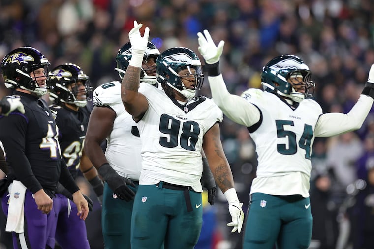 Eagles defensive tackle Jalen Carter and linebacker Jeremiah Trotter Jr. react after Baltimore Ravens place kicker Justin Tucker missed a third quarter 41-yard field goal on Sunday, Dec. 1, 2024 at M&T Bank Stadium.