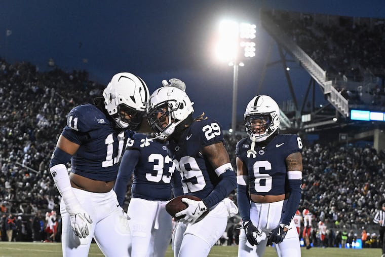 Penn State cornerback Audavion Collins (29) celebrates after an interception with Abdul Carter earlier this season. The No. 3 Nittany Lions are one win away from their second Big Ten title in the James Franklin era.