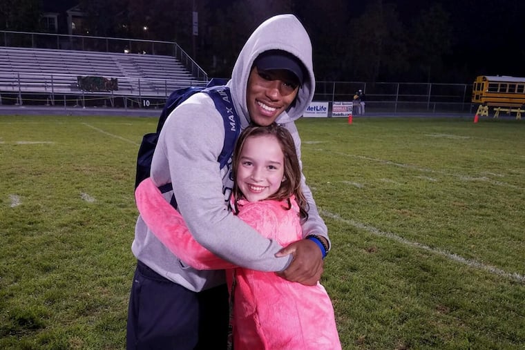 Saquon Barkley and the girl he babysat, Maisey Hartman, at Whitehall High School in 2016.