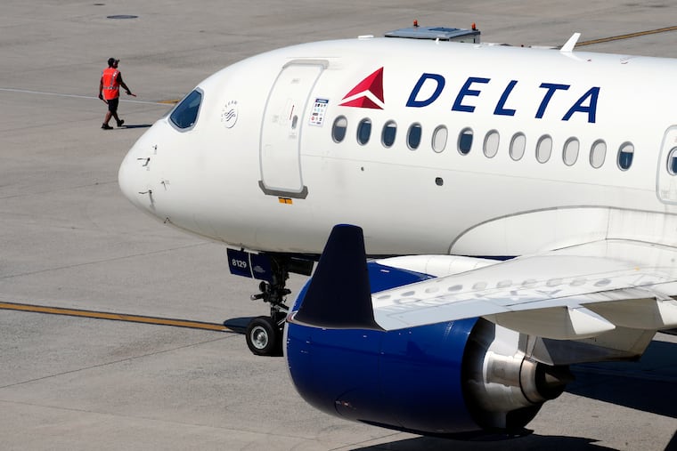 A Delta Air Lines jet leaves a gate in Boston in July.