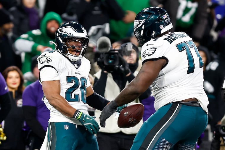 Eagles running back Saquon Barkley, right, led the NFL in rushing yards (626) and scrimmage yards (777) in November.