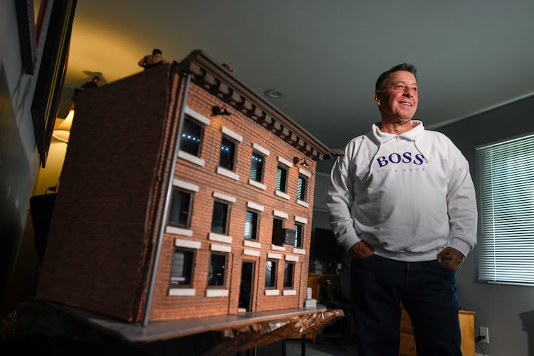 Joey Umana, 62, a total Rocky fan, is seen in the Rocky Room, in his home in Levittown, N.Y. He is seen with his memorabilia and his artistic creations such as very detailed models of the gym where Rocky trained, the art museum facade and steps, even the side of beef Rocky trained with.