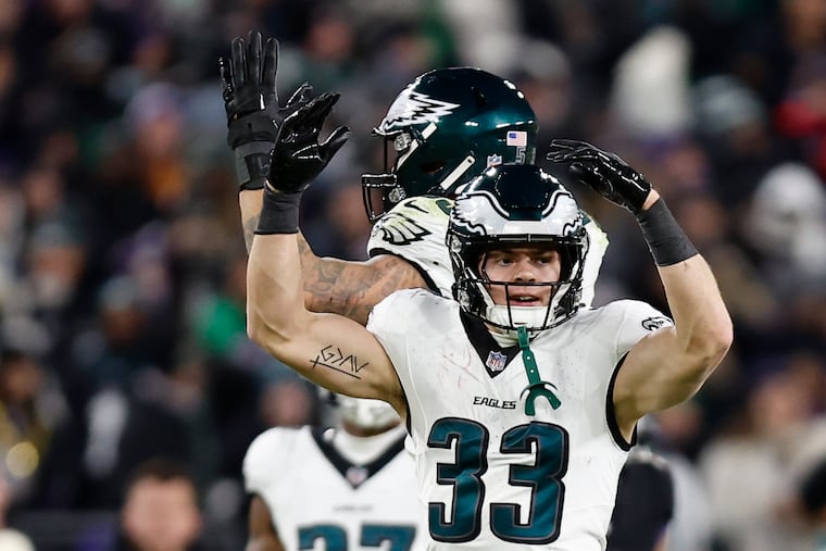 Eagles cornerback Cooper DeJean celebrates his stop on Baltimore Ravens running back Derrick Henry in the fourth quarter Sunday.