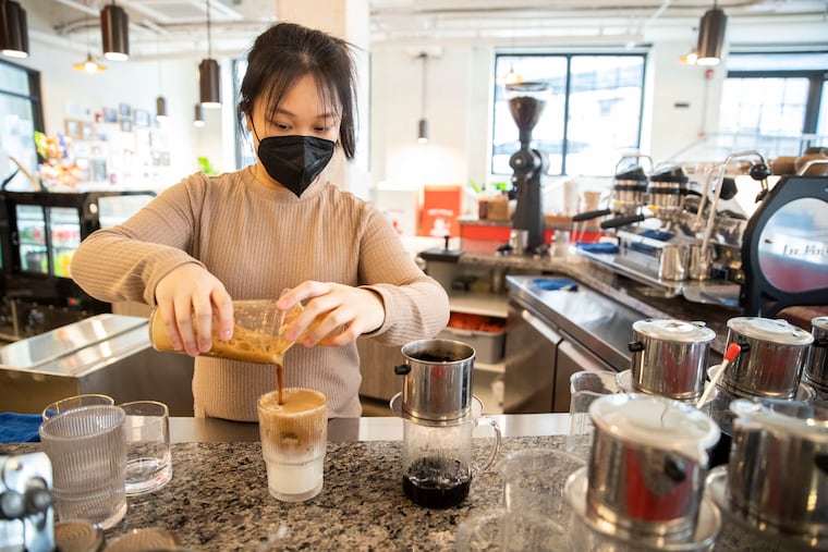 Barista Dana Huynh prepares a Bac Xiu, a shaken espresso latte, at Caphe Roasters in Philadelphia, Pa. on Thursday, January 20, 2022. Caphe Roasters is Vietnamese specialty coffee roastery.