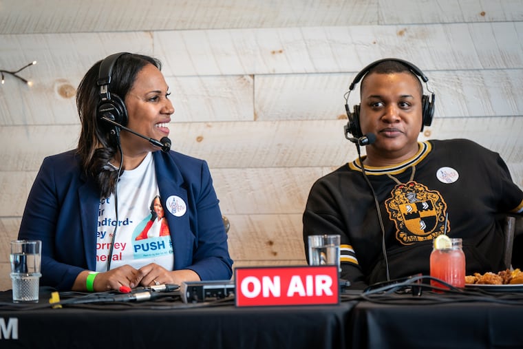 Journalist Ernest Owens with Keir Bradford-Grey, a candidate for Pennsylvania attorney general, during a WURD-AM radio interview at South Restaurant in April 2024.