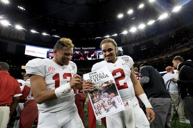 Alabama quarterbacks Tua Tagovailoa (left) and Jalen Hurts celebrate after the Crimson Tide beat Clemson in the Sugar Bowl on Jan. 1, 2018.