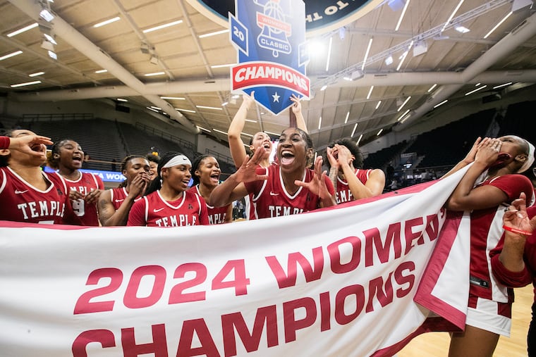 Tiarra East and her Temple teammates celebrate their victory over Villanova in the championship game of the women's Big Five Classic.