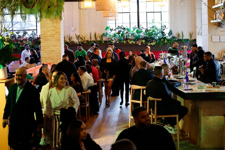 The dining room and bar area at Mamajuana Cafe, a sultry Latin-inspired restaurant in Fishtown.