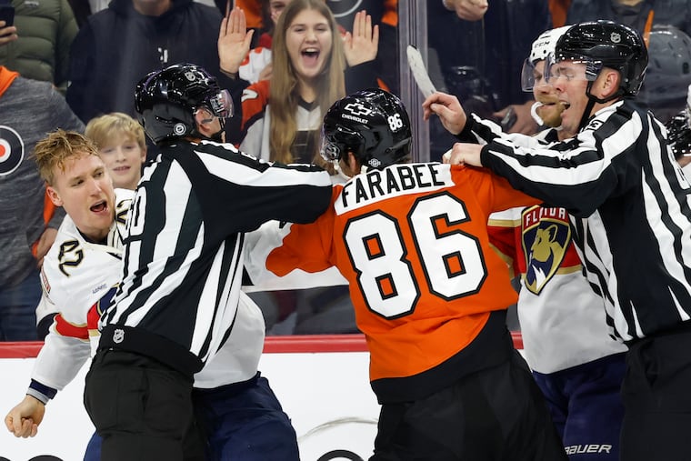 Linesmen stop the Flyers' Joel Farabee and the Panthers' Gustav Forsling from fighting in the third period on Thursday.