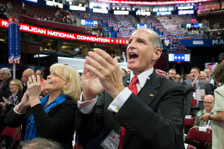 Pennsylvania delegates Carolyn Bunny Welsh, back left, and Lawrence Tabas, front right, at the RNC in Cleveland, Ohio on Monday, July 18, 2016.