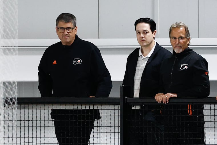 Flyers president Keith Jones (left) and GM Danny Brière (center) don't think John Tortorella has any plans of retiring soon.