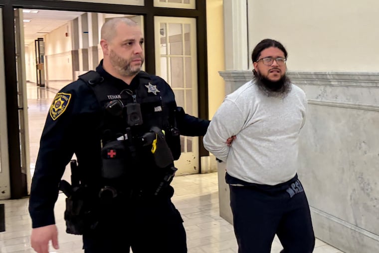 Ramon Garcia is escorted into a courtroom at the Montgomery County Courthouse on Thursday. Garcia, 34, pleaded guilty to aggravated indecent assault, invasion of privacy and related crimes.