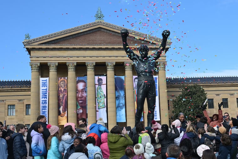 People gathered around the Rocky statue at the top of the steps of the Philadelphia Museum of Arts on Tuesday, Dec. 3, 2024 during an unveiling ceremony to o Kick Off First-Ever Rocky Festival in Philadelphia, Pa. Sylvester Stallone lends his Rocky statue to the city for Rocky Fest and it will be placed on top of the steps of the Philadelphia Museum of Art, where it was in Rocky III, for a month.
